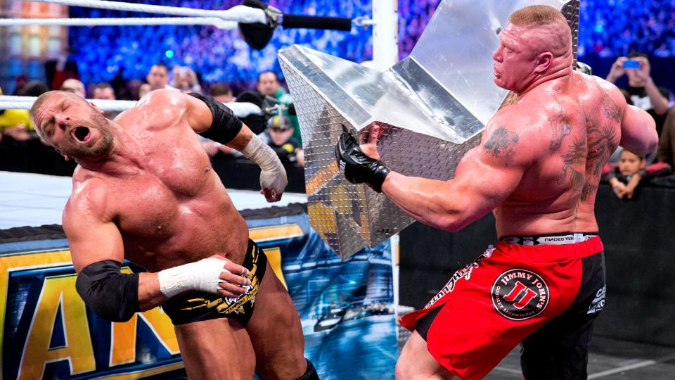 Triple H vs. Brock Lesnar (Credits: WWE)